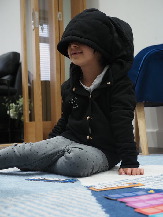 Child wearing a sensory hoodie